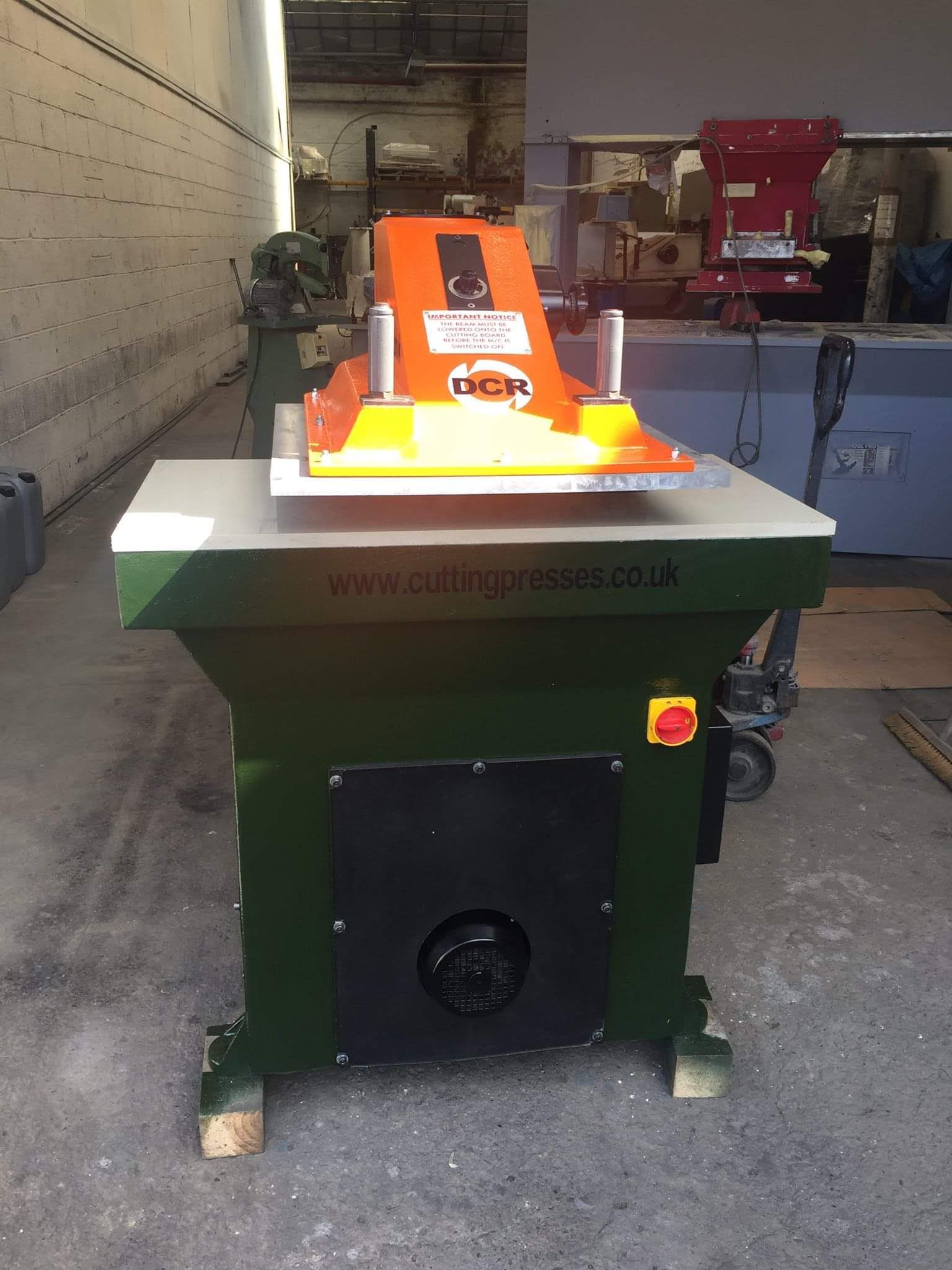 Photo of an ATOM-SE25 CLICKER PRESS ORANGE Industrial Sewing Machines